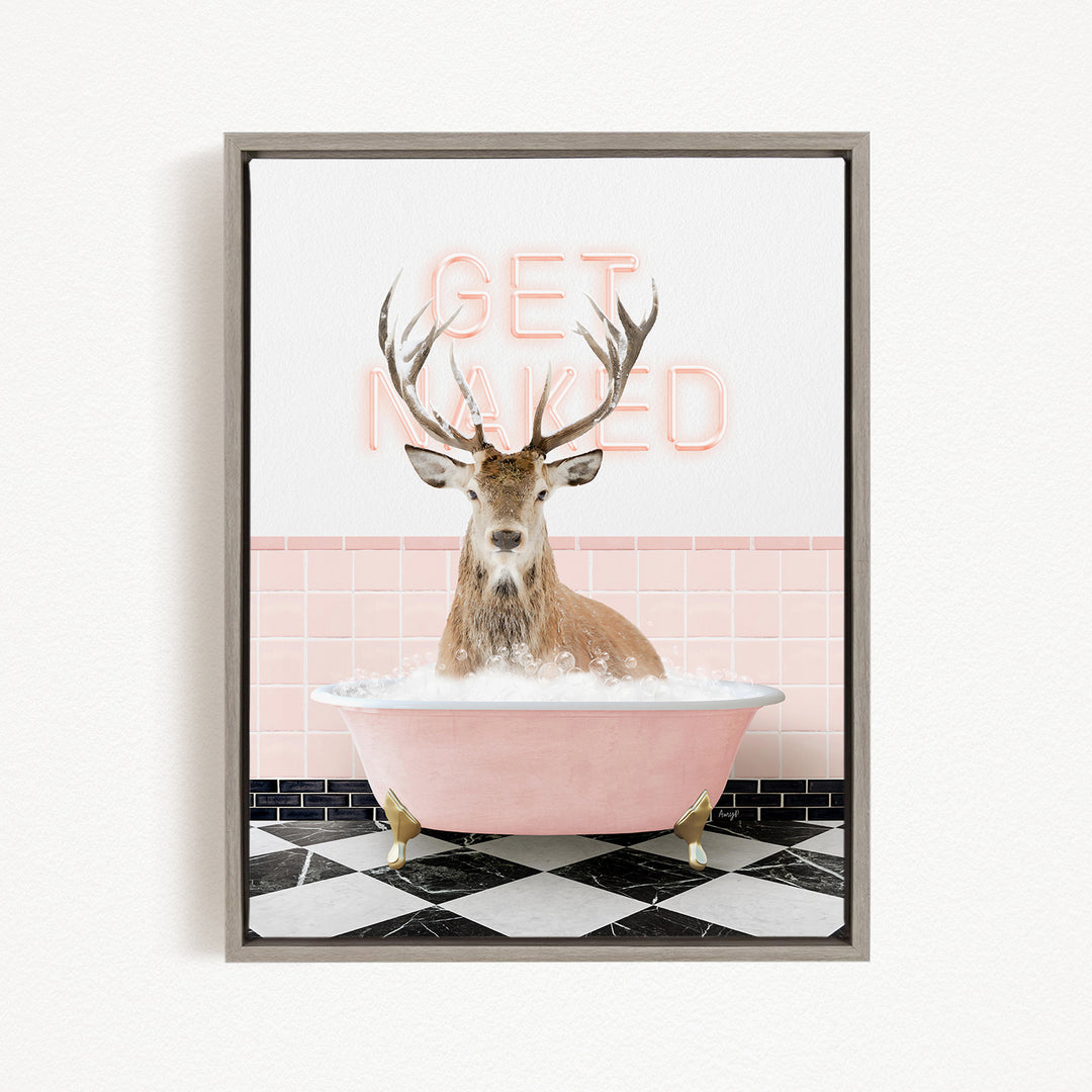 A deer with antlers is sitting in a pink bathtub, with the words "GET NAILED" written in neon pink letters above it.