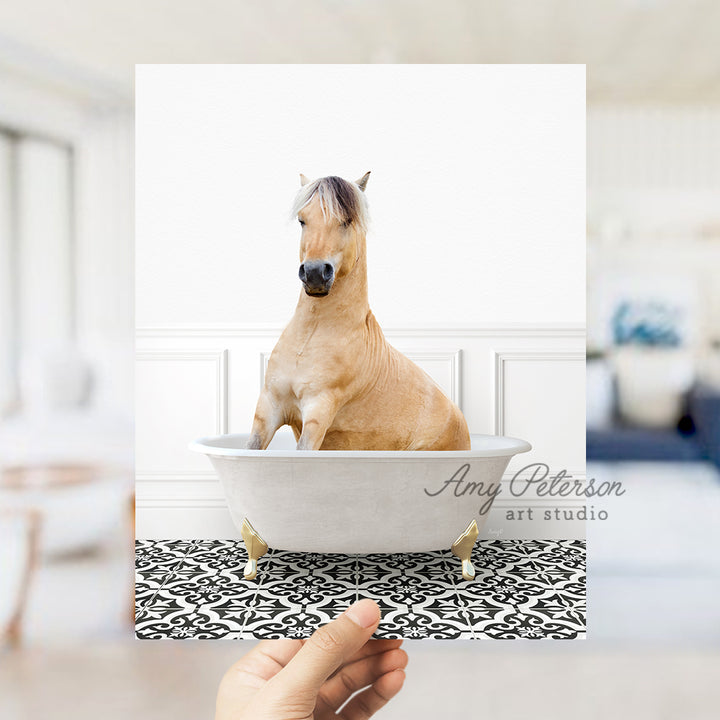 a person holding a card with a horse in a bathtub