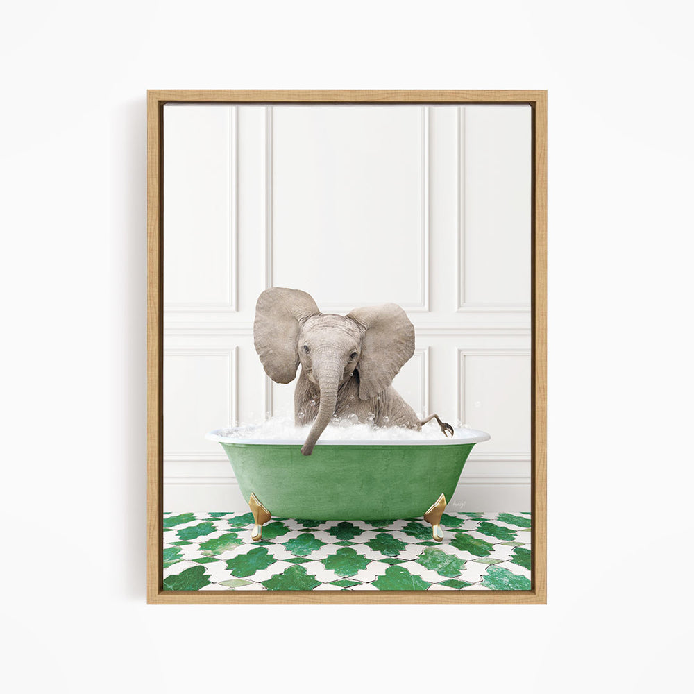 A baby elephant sitting in a green bathtub filled with water, surrounded by a green and white patterned floor.