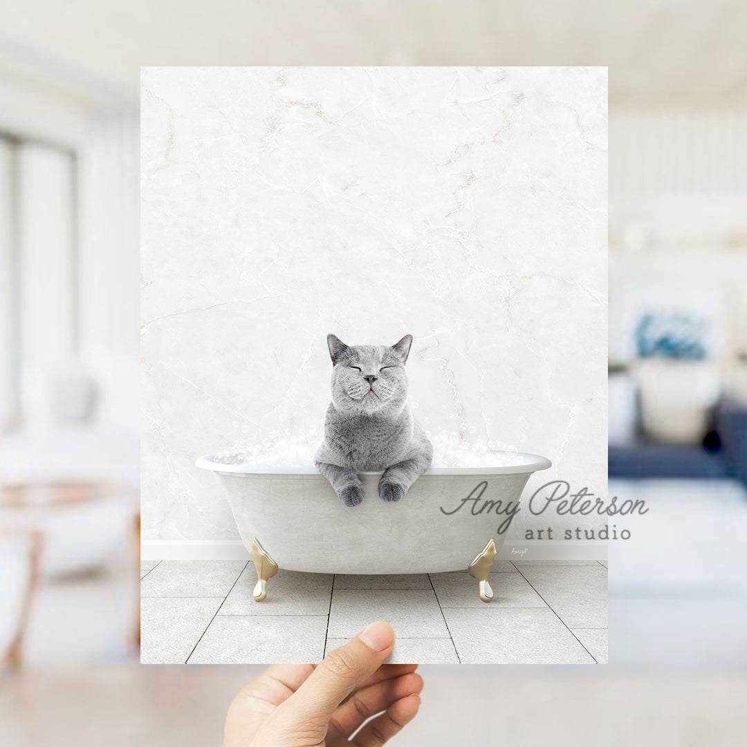 a hand holding a card with a cat in a bathtub