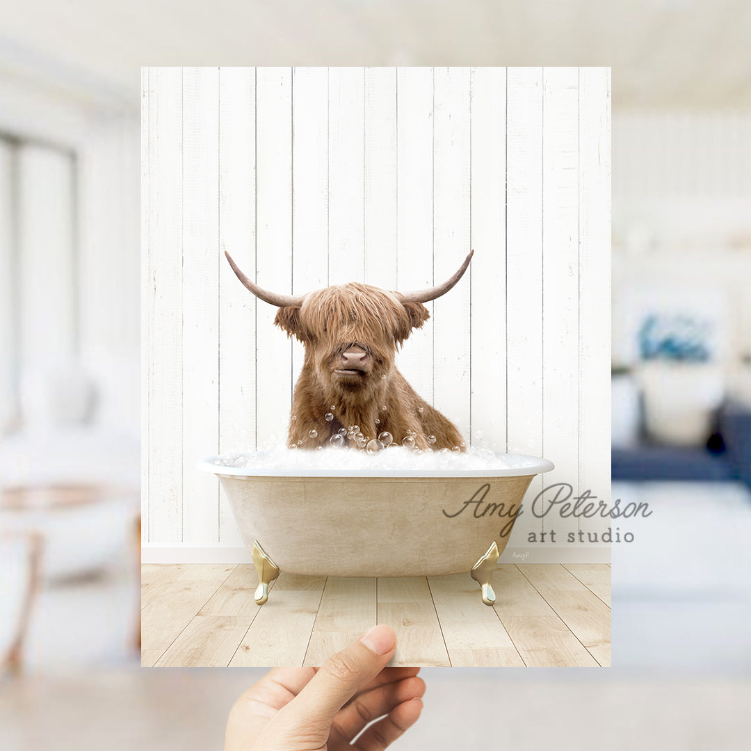 a hand holding a photo of a dog in a bathtub