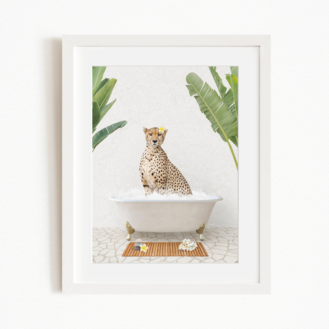A cheetah sitting in a bathtub filled with water, surrounded by tropical plants and flowers.