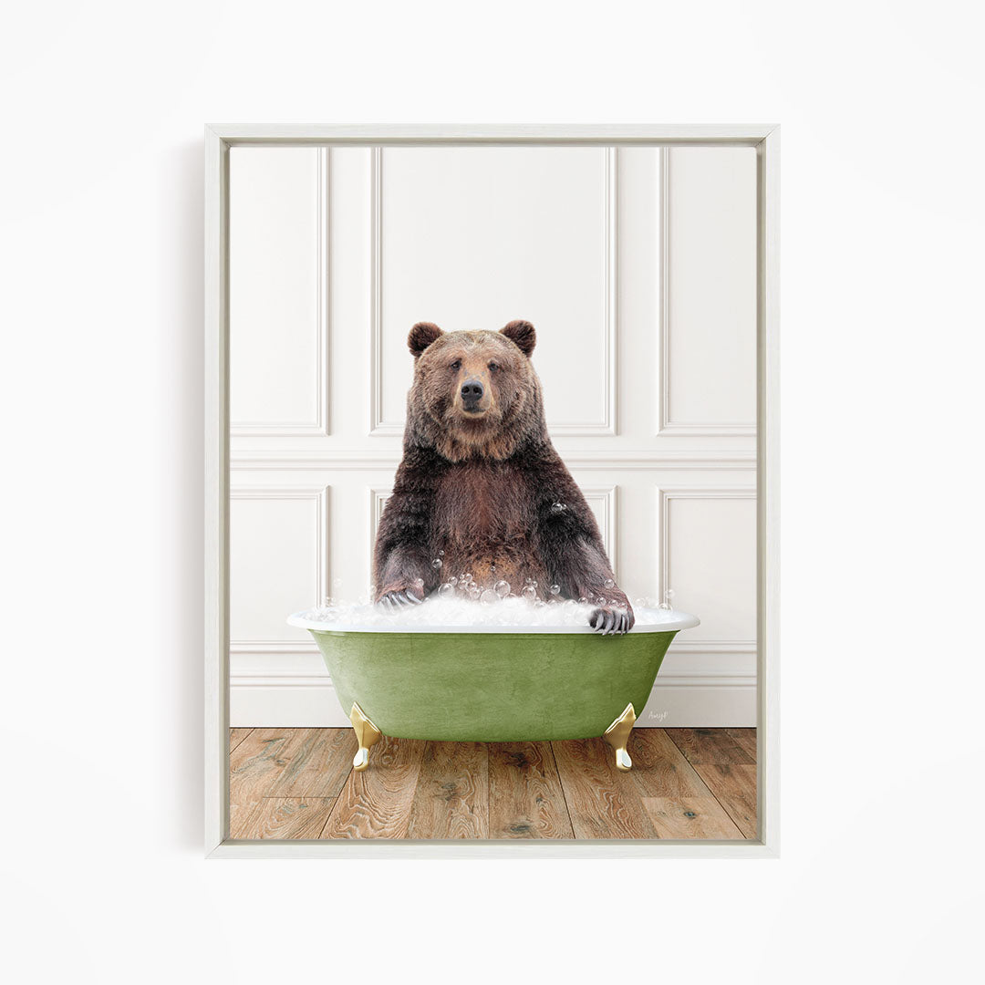 A brown bear sitting in a green bathtub filled with water, appearing to enjoy the bath.