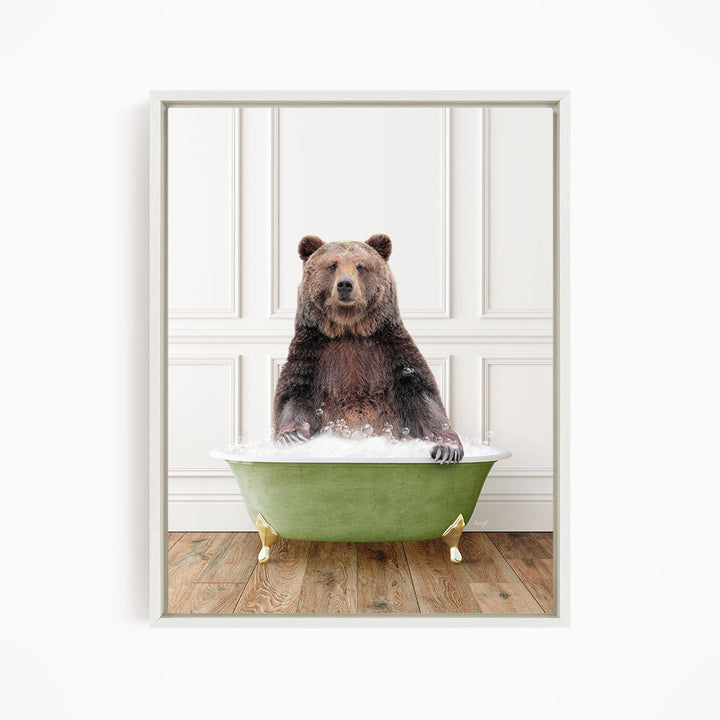 A brown bear sitting in a green bathtub filled with water, appearing to enjoy the bath.