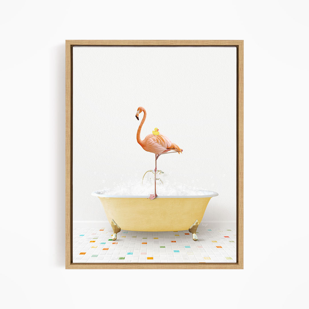 A pink flamingo stands on a yellow bathtub filled with bubbles, with a yellow rubber duck perched on its back.
