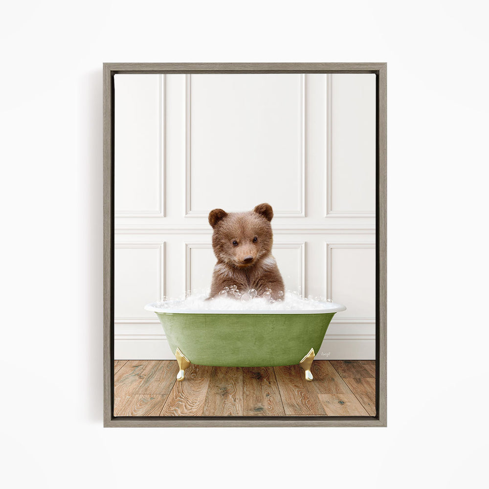 A cute brown bear sitting in a green bathtub filled with bubbles, looking directly at the camera.