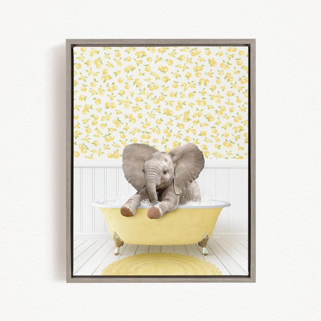 A baby elephant sitting in a yellow bathtub, surrounded by a yellow and white floral pattern on the wall behind it.