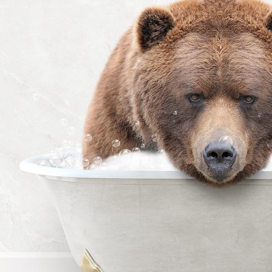 a brown bear is taking a bath in a bathtub