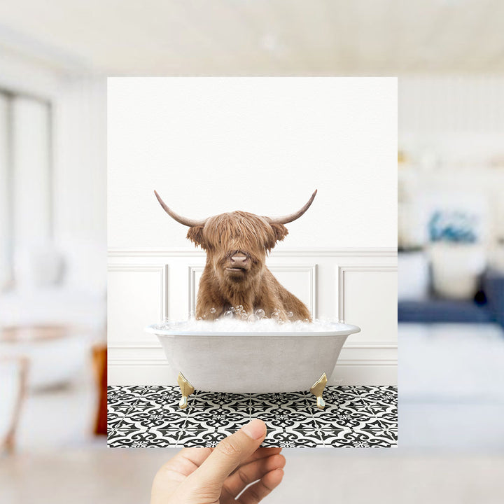 A brown Highland cow with long horns is sitting in a white bathtub filled with water, creating a whimsical and amusing scene.