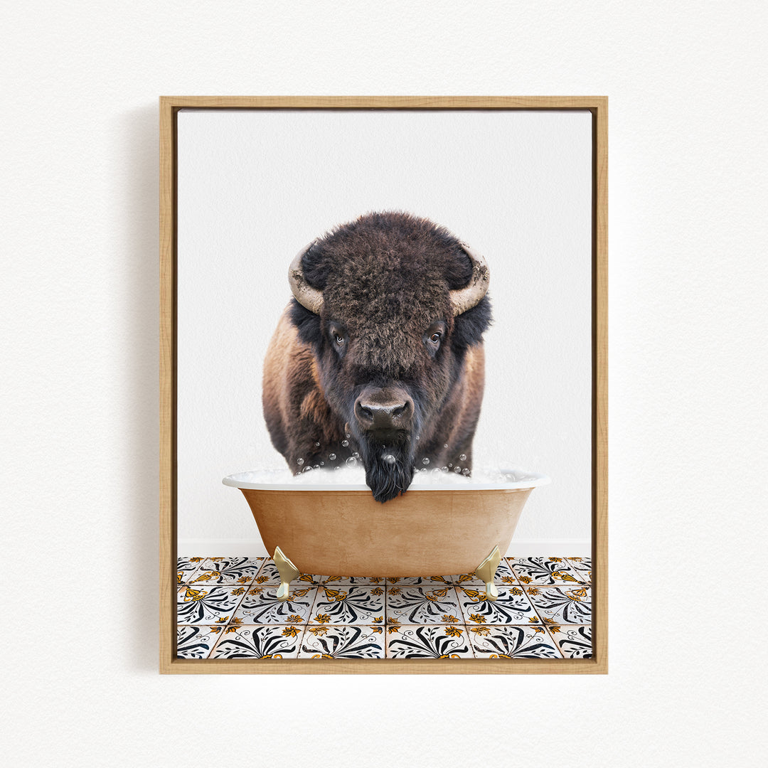 A buffalo with large horns is standing in a bowl of water, with a patterned tile floor beneath it.