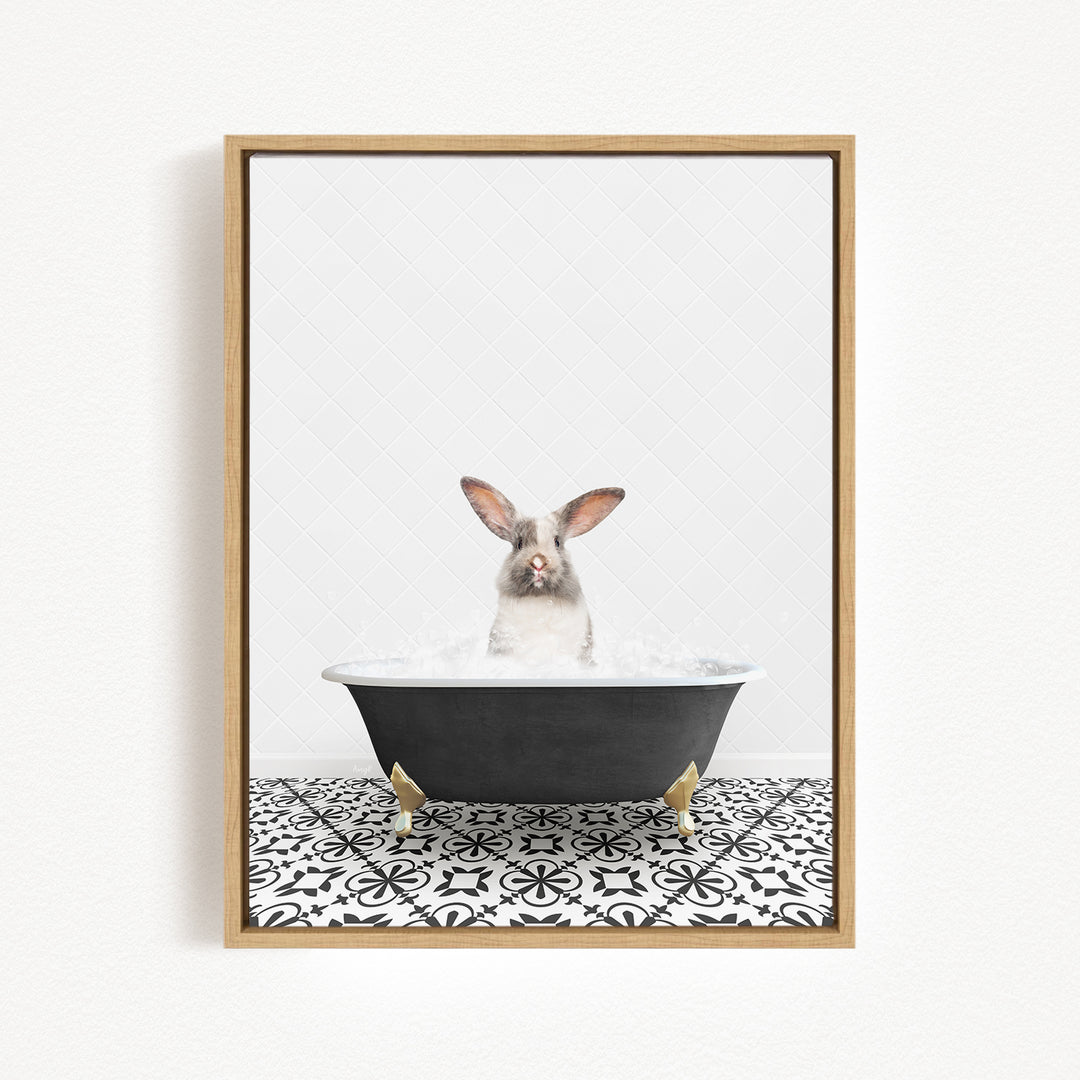 A white rabbit sitting in a black bathtub filled with water, with a black and white patterned tile floor beneath it.
