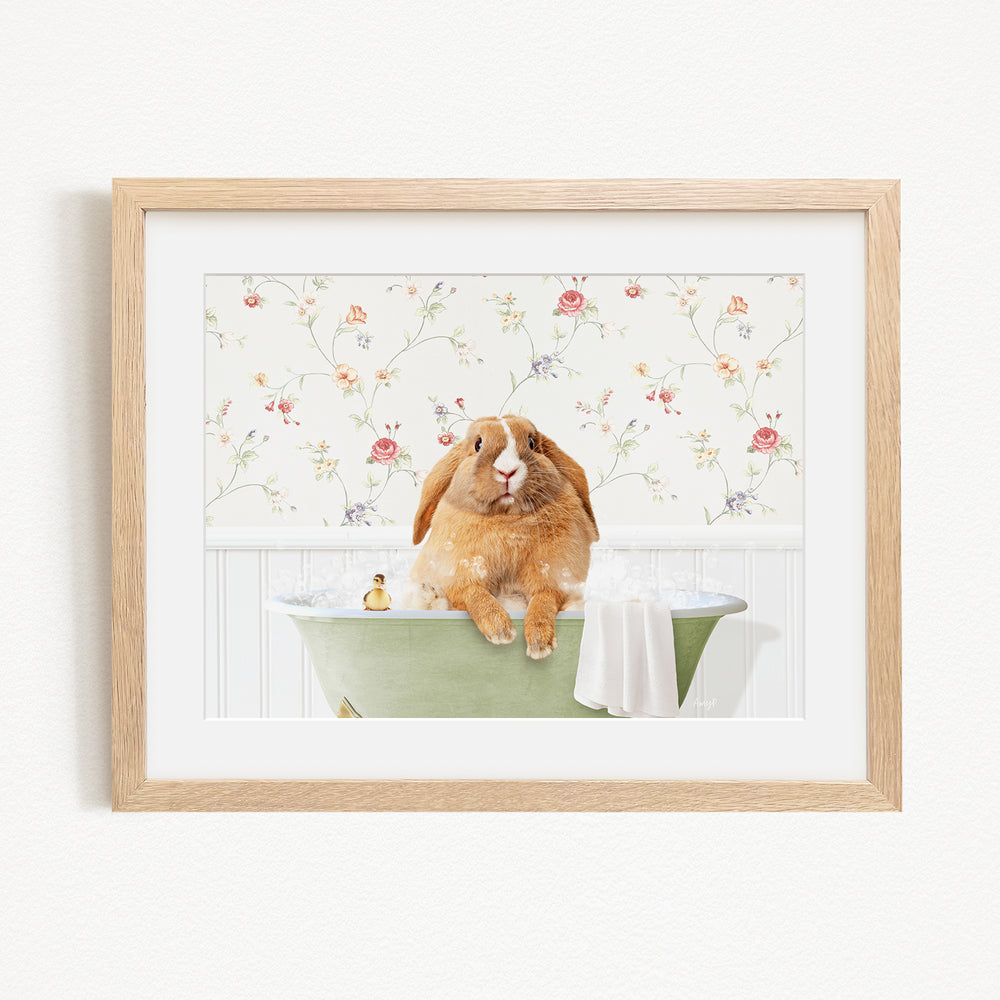 A brown rabbit sitting in a green bathtub filled with water, surrounded by a floral patterned wall.