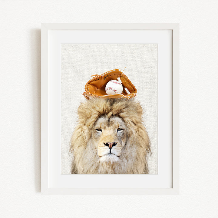A framed image of a lion wearing a baseball glove on its head.