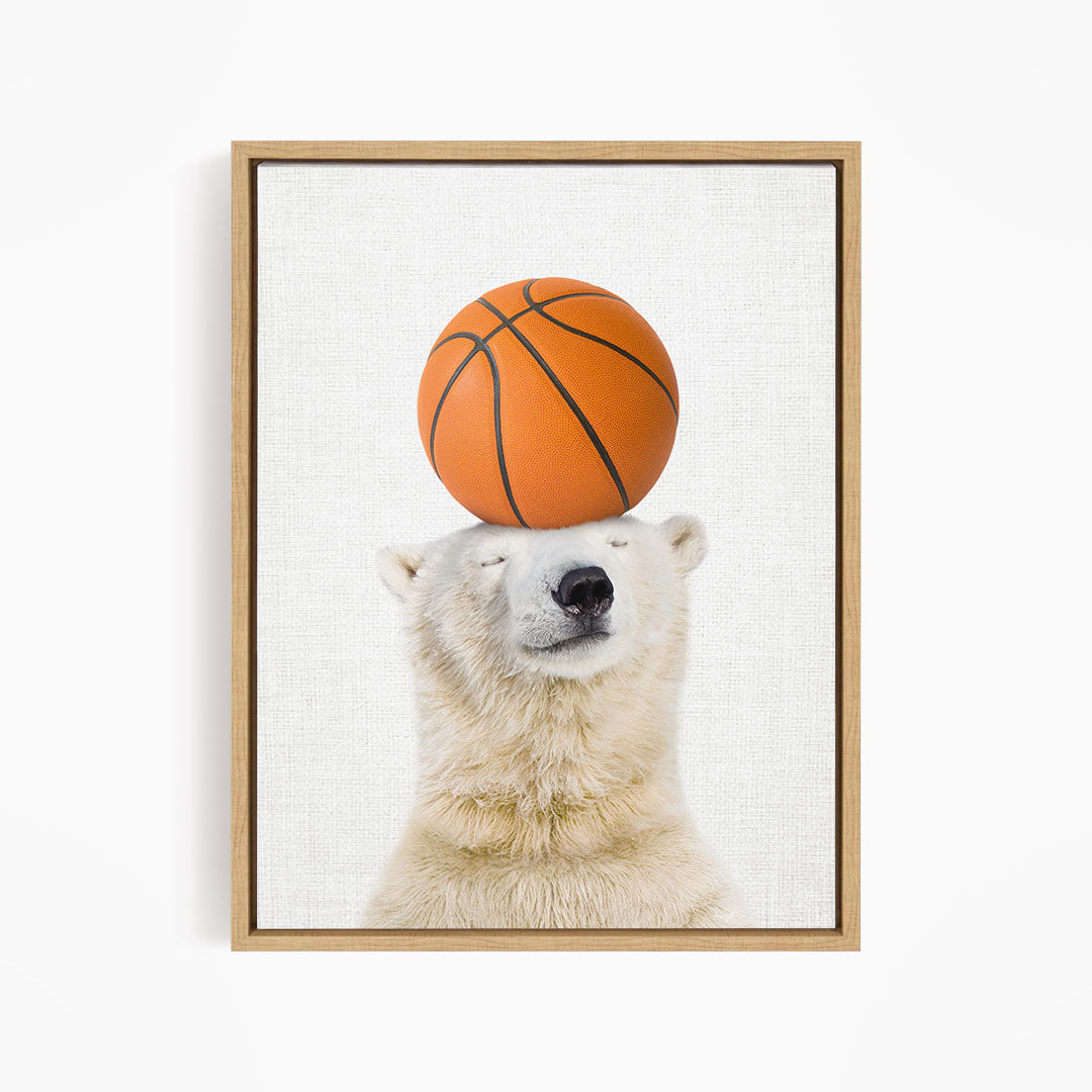 A polar bear balancing a basketball on its head.