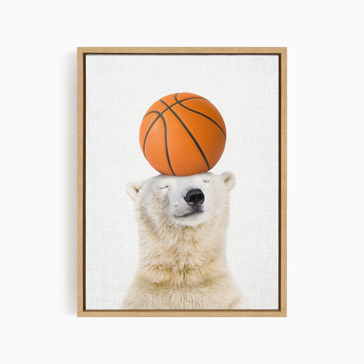 A polar bear balancing a basketball on its head.