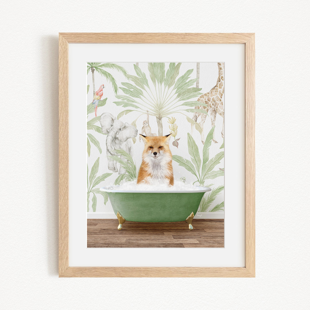 A framed print depicting a fox sitting in a green bathtub, surrounded by various animals such as a giraffe, elephant, and parrot, all set against a tropical leafy background.