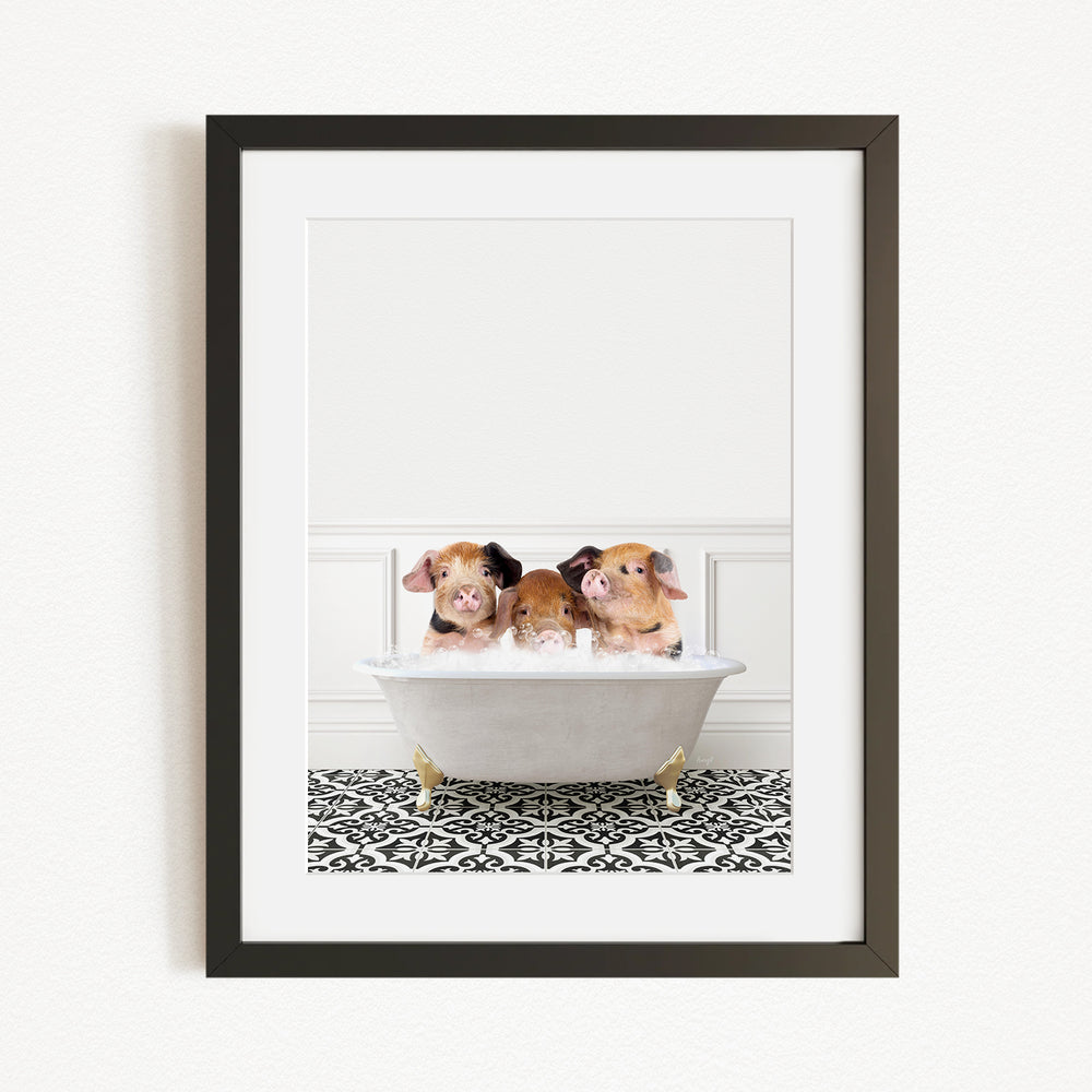 Three adorable pigs sitting in a white bathtub, enjoying a relaxing bath.