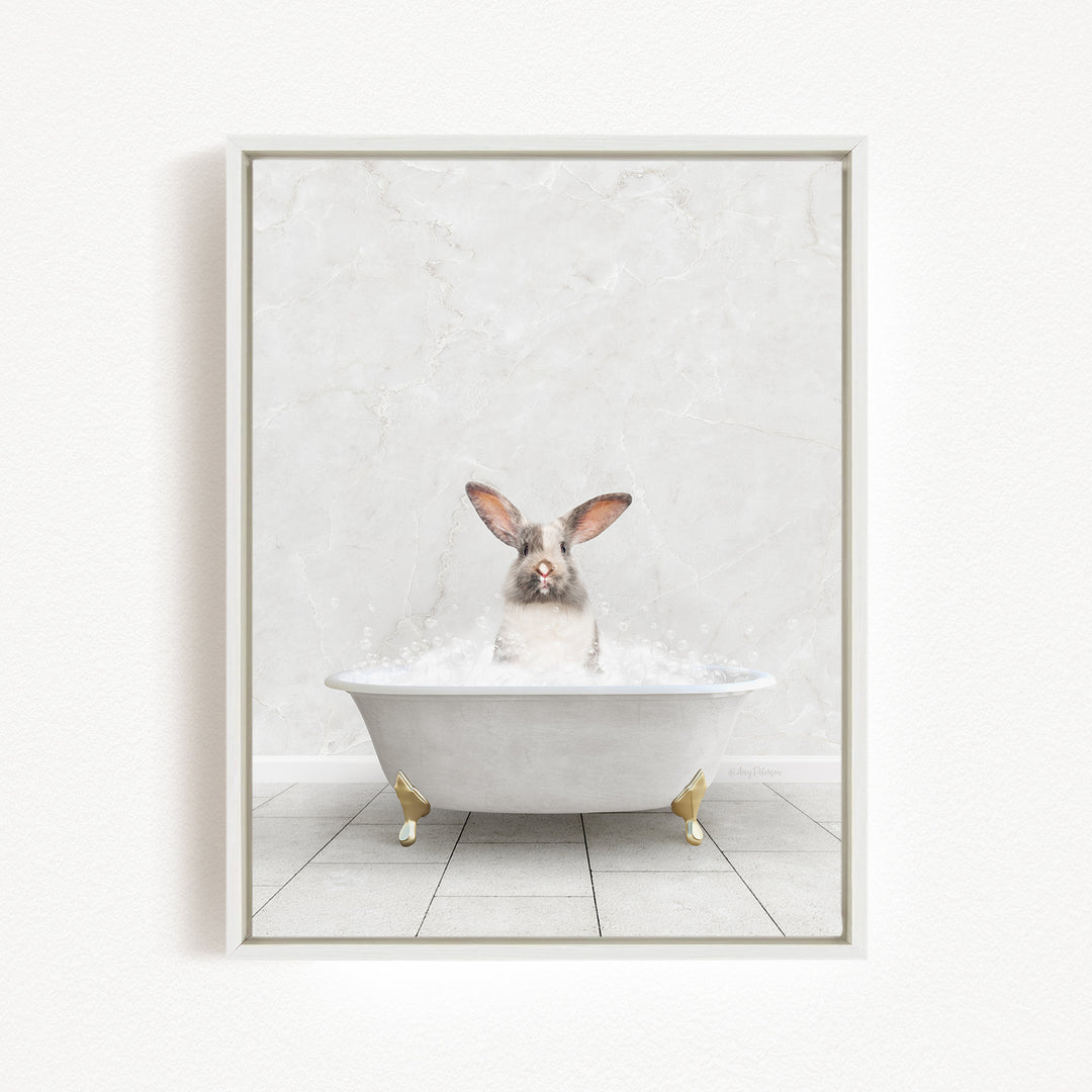 A white rabbit sitting in a white bathtub filled with water, with its head above the water's surface.