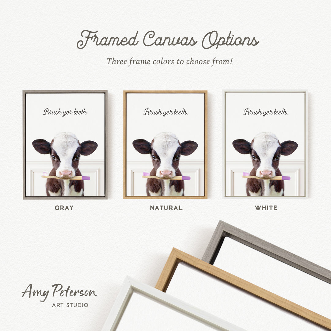 three framed canvas options featuring a cow holding a toothbrush. The options include three different frame colors: gray, natural, and white.
