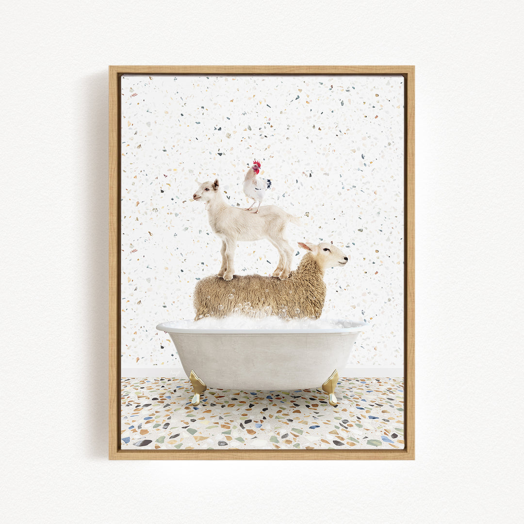A framed image depicting a white goat standing on a bathtub filled with water, with a chicken perched on top of the goat.