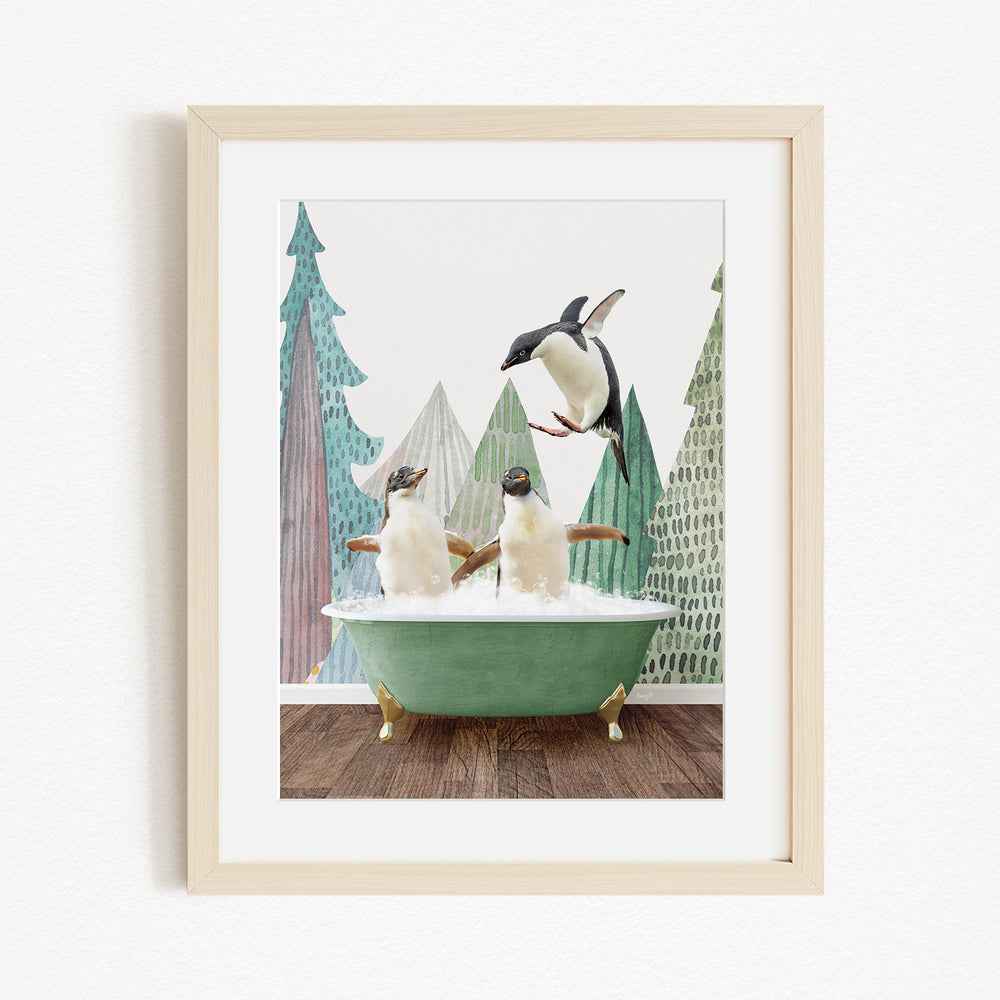 A framed image depicting two penguins sitting in a green bathtub, with one penguin flying towards the other in mid-air.