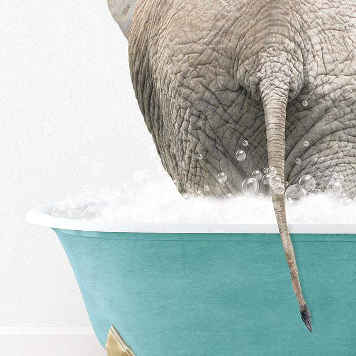 an elephant is taking a bath in a bathtub