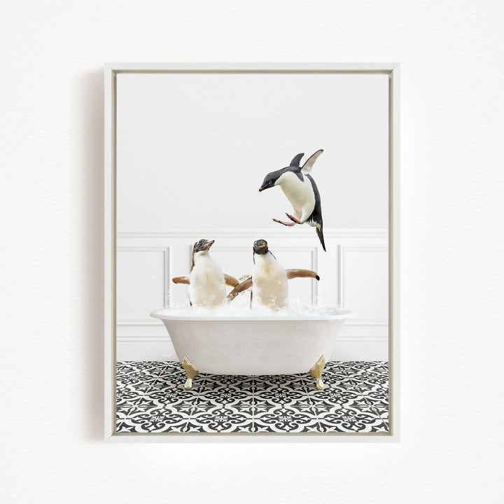 A framed image depicting two penguins sitting in a bathtub, with one penguin flying out of the tub.