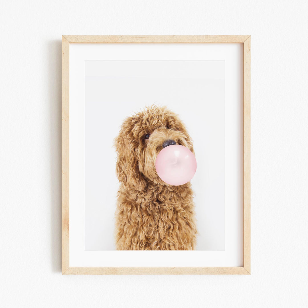 a dog with a bubble gum in its mouth