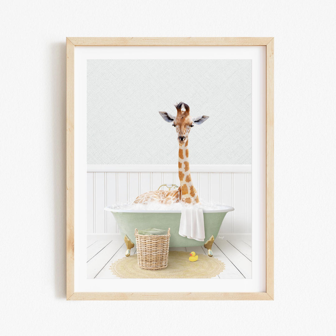 A giraffe standing in a green bathtub filled with water, surrounded by a basket of toys and a yellow rubber duck.
