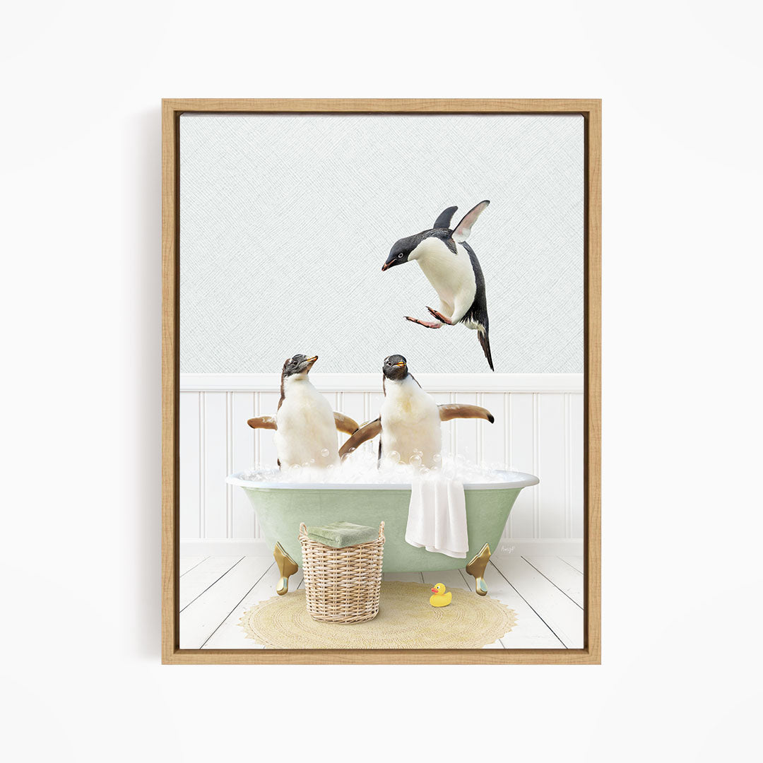 A framed image depicting two penguins sitting in a green bathtub, with one penguin flying towards the other.