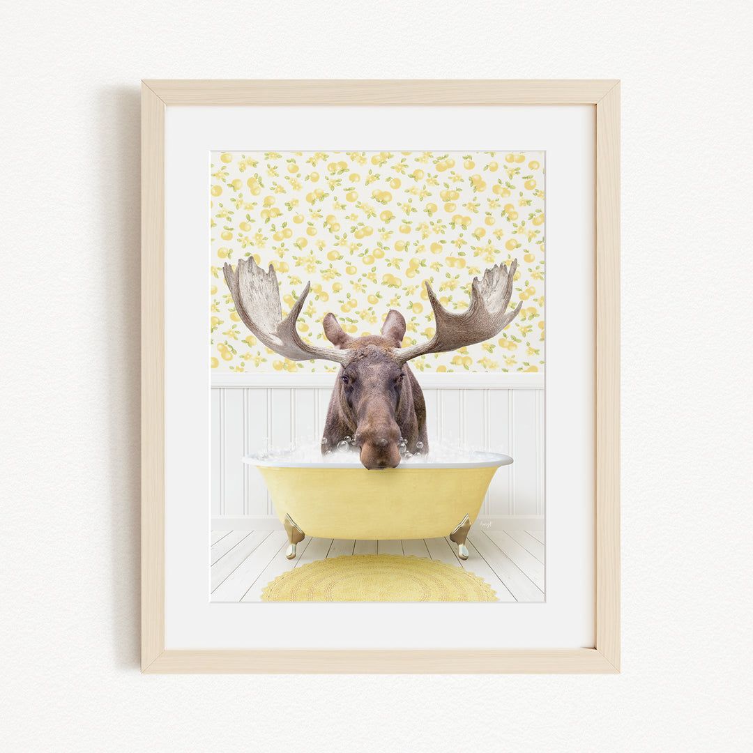 A moose with large antlers is sitting in a yellow bathtub, surrounded by a yellow floral pattern on the wall behind it.