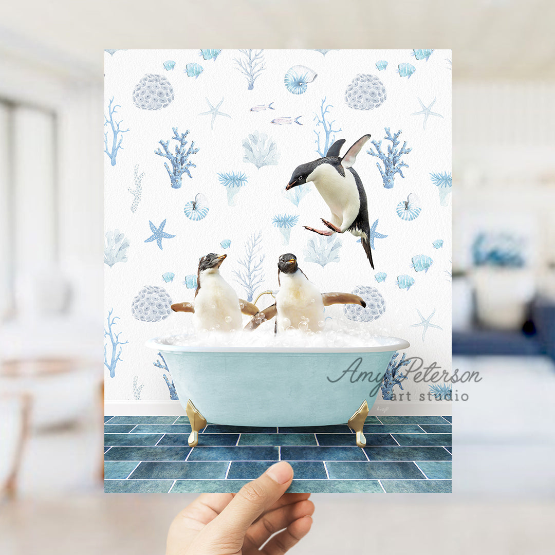 a hand holding up a card with penguins in a bathtub