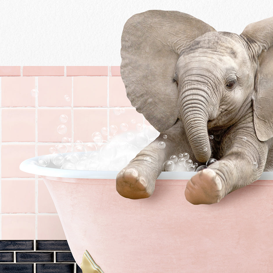 a baby elephant taking a bath in a bathtub