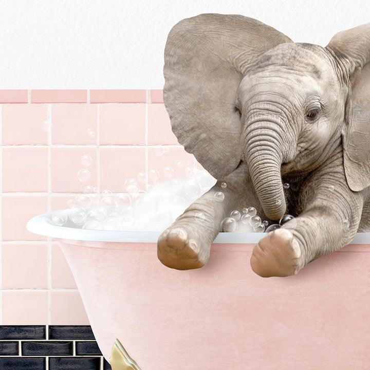 a baby elephant taking a bath in a bathtub