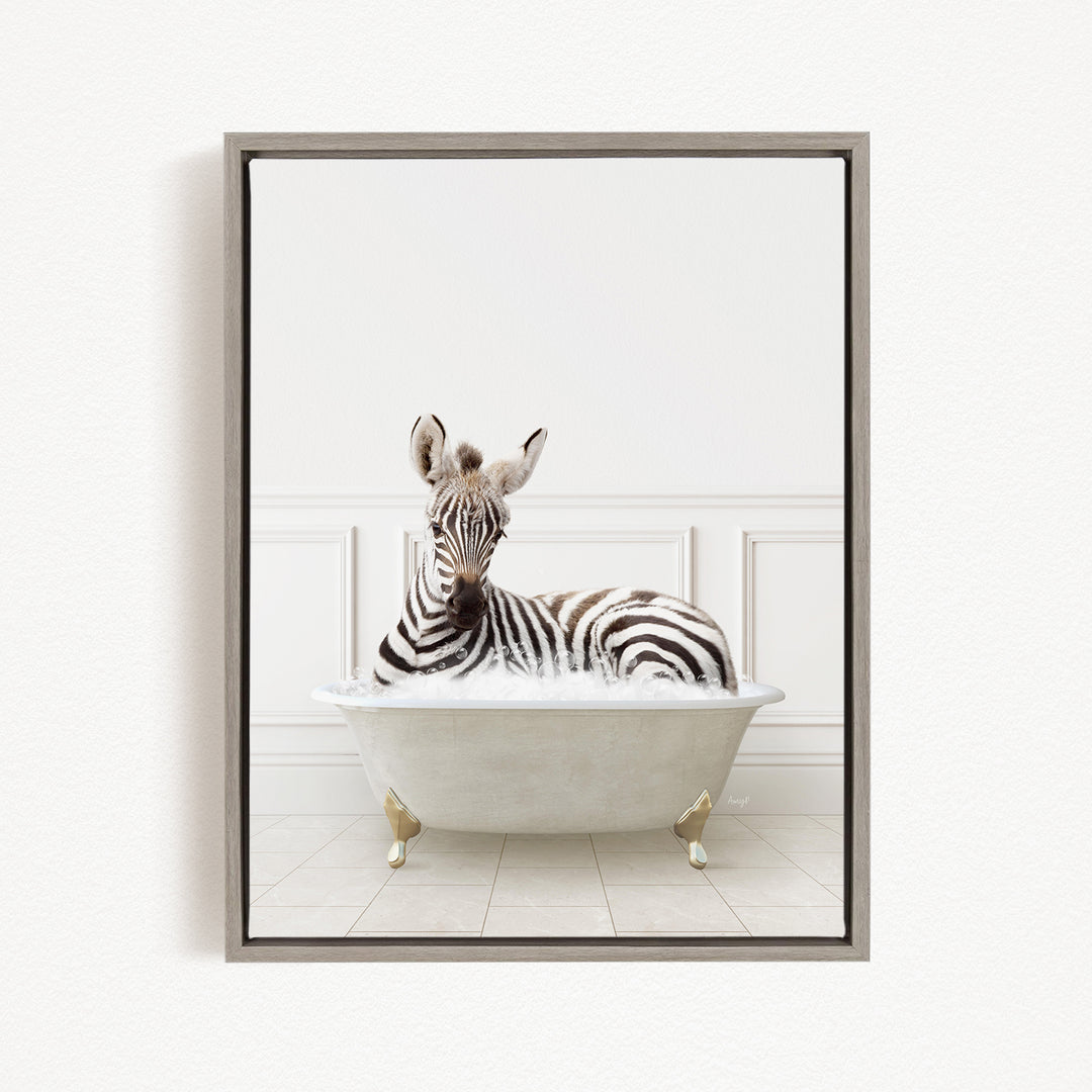 A zebra is sitting in a white bathtub, surrounded by a white wall and tiled floor.