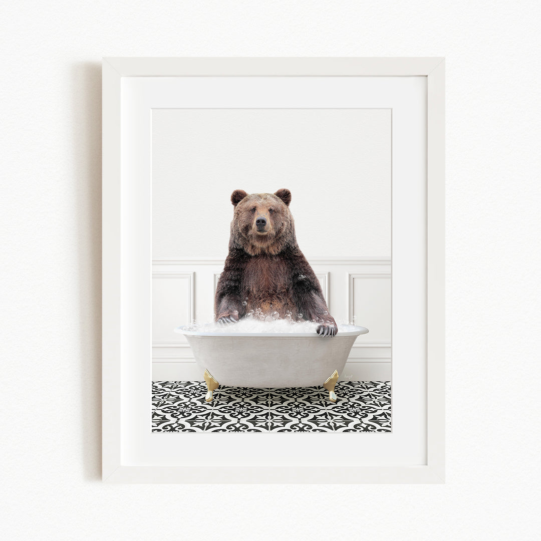 A brown bear sitting in a white bathtub filled with water, surrounded by a black and white patterned floor.