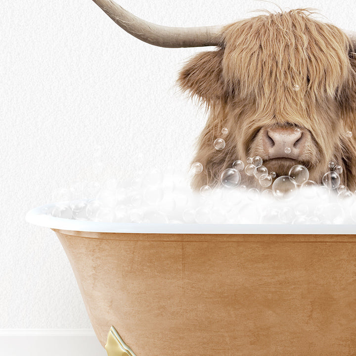 a bull with long horns sitting in a bathtub filled with bubbles