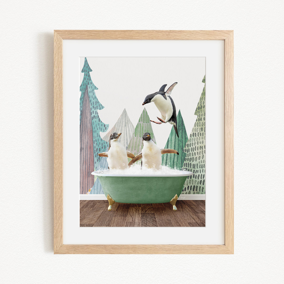 A framed image depicting two penguins sitting in a green bathtub, with one penguin flying towards the other in mid-air.