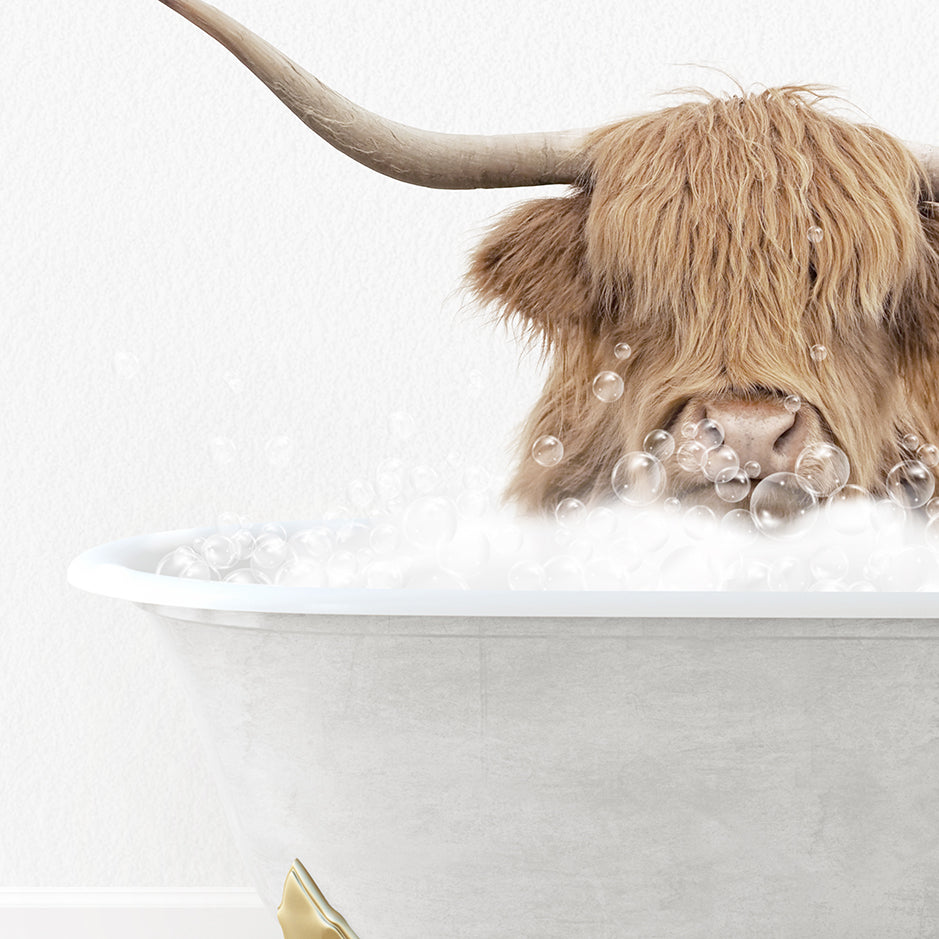 a long haired cow sitting in a bathtub filled with bubbles