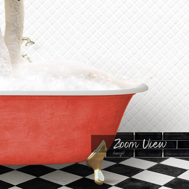 A red clawfoot bathtub filled with bubbles, with a gold clawfoot foot resting on the floor.
