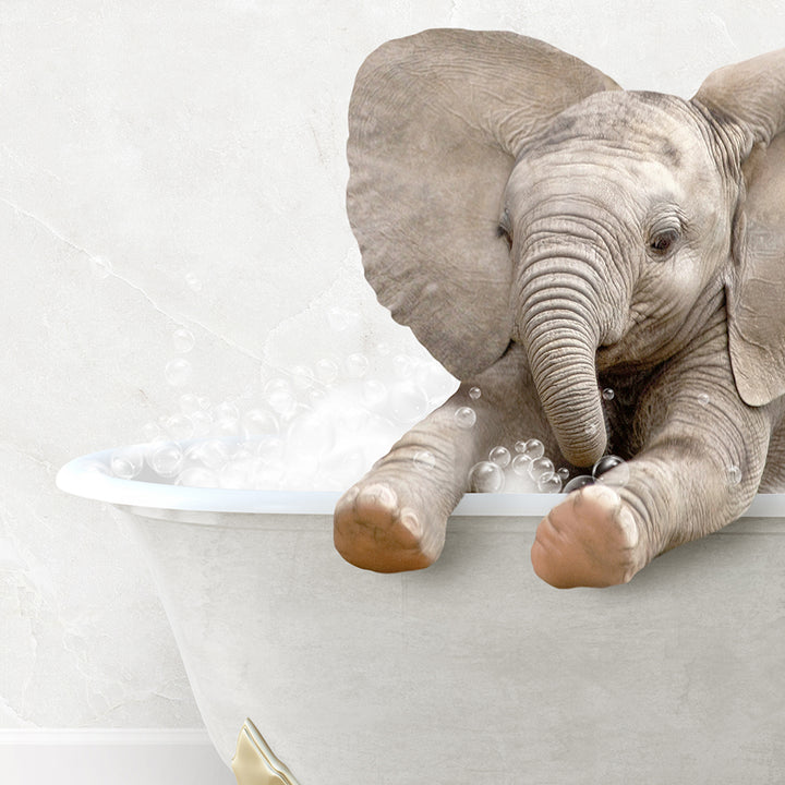 a baby elephant taking a bath in a bathtub