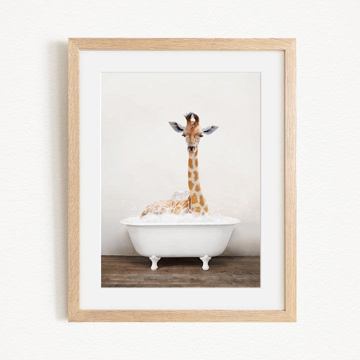 A giraffe sitting in a white bathtub filled with water, creating a whimsical and playful scene.