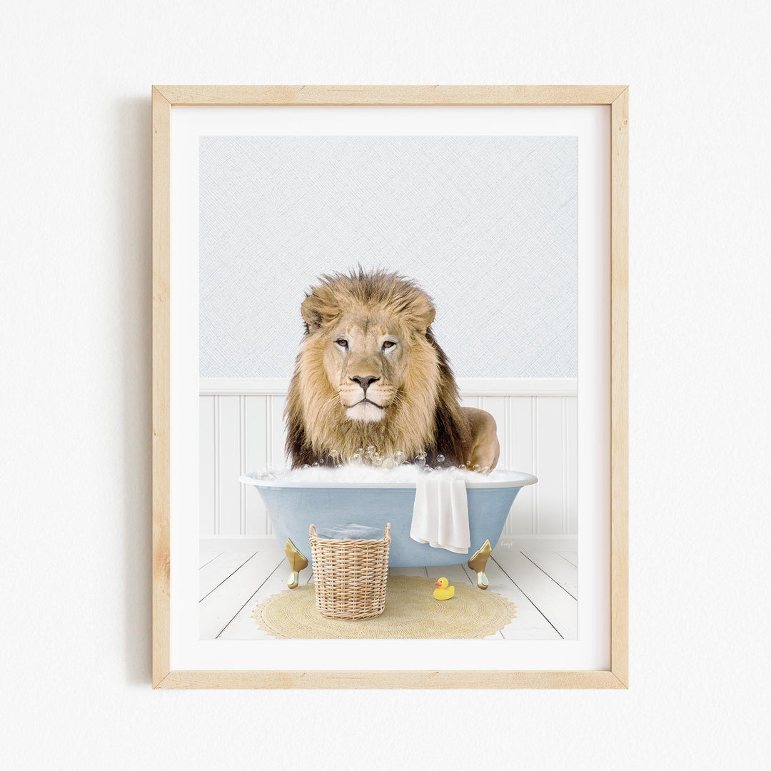 A lion sitting in a blue bathtub filled with water, surrounded by a yellow rubber duck and a basket.