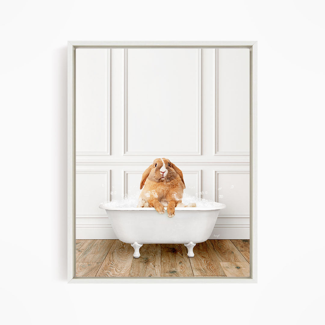 A brown rabbit sitting in a white bathtub filled with water, enjoying a relaxing bath.