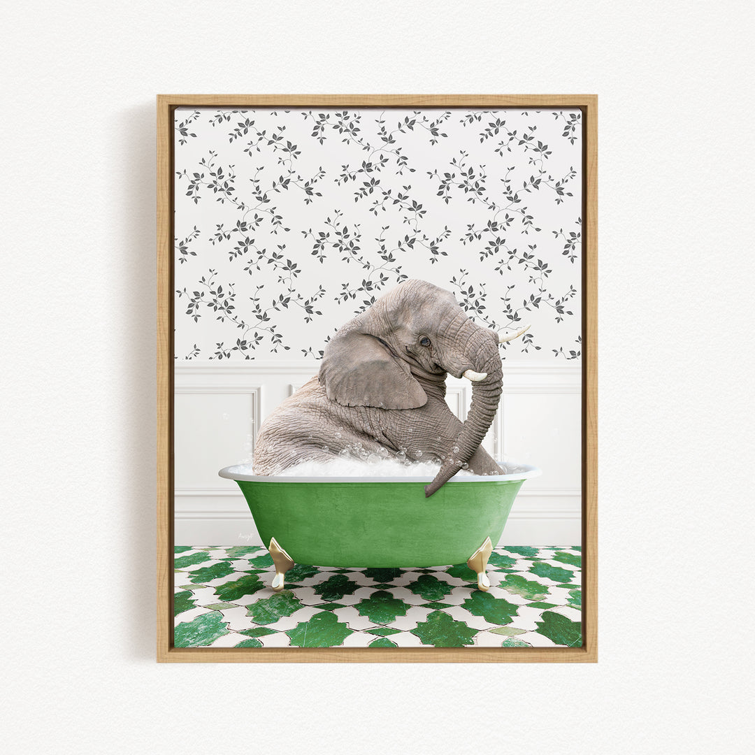 A gray elephant is sitting in a green bathtub, surrounded by a patterned green and white floor.