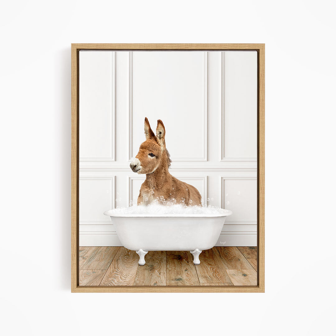 A donkey is sitting in a white bathtub filled with bubbles, creating a playful and whimsical scene.