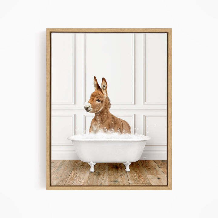 A donkey is sitting in a white bathtub filled with bubbles, creating a playful and whimsical scene.