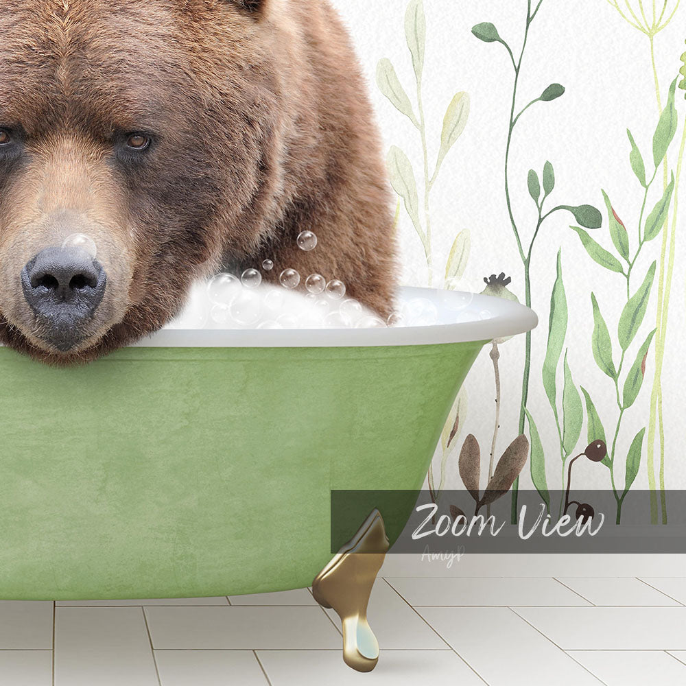 A large brown bear is sitting in a green bathtub filled with bubbles, surrounded by a floral pattern on the wall behind it.