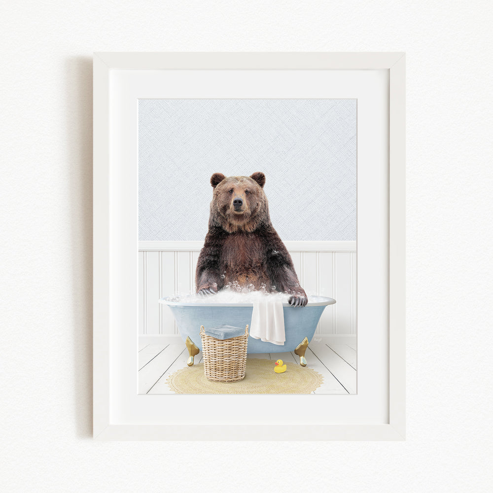 A brown bear sitting in a blue bathtub filled with water, surrounded by rubber ducks and a basket.