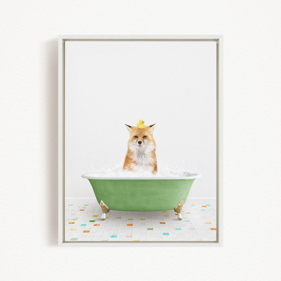 A fox is sitting in a green bathtub filled with bubbles, with a rubber duck perched on its head.